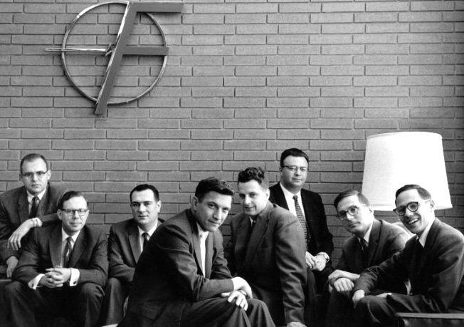 Fairchild Semiconductor's founders - Traitorous Eight - under the company logo